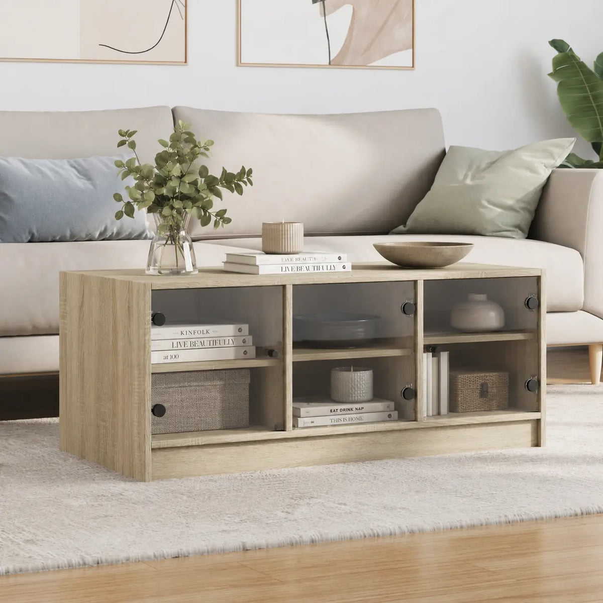 Table basse rectangulaire en bois clair avec rangements intégrés et panneaux en verre, mise en scène dans un salon contemporain