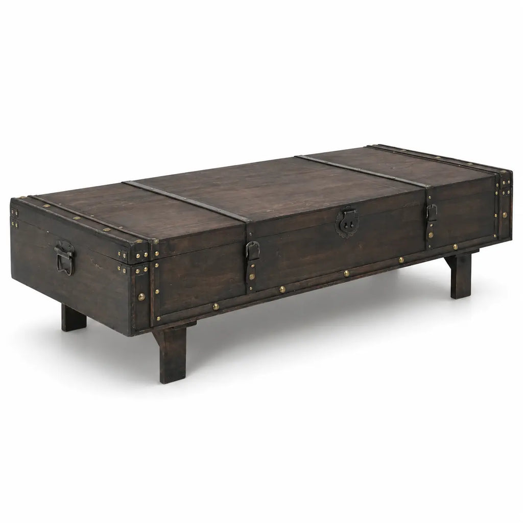 Table basse style malle vintage en bois foncé avec ferrures métalliques et design rustique industriel