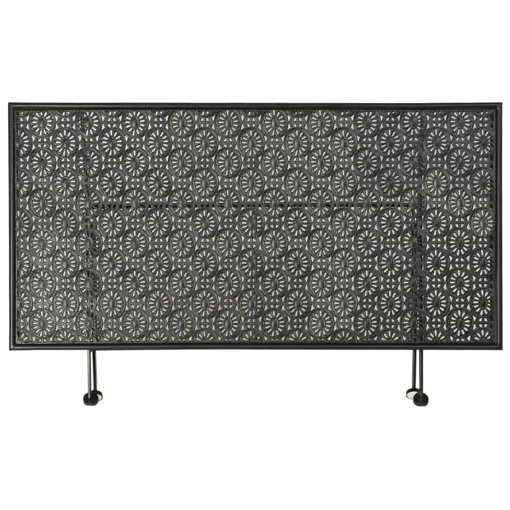 Table basse pliée en métal noir avec plateau ajouré décoratif et design vintage compact