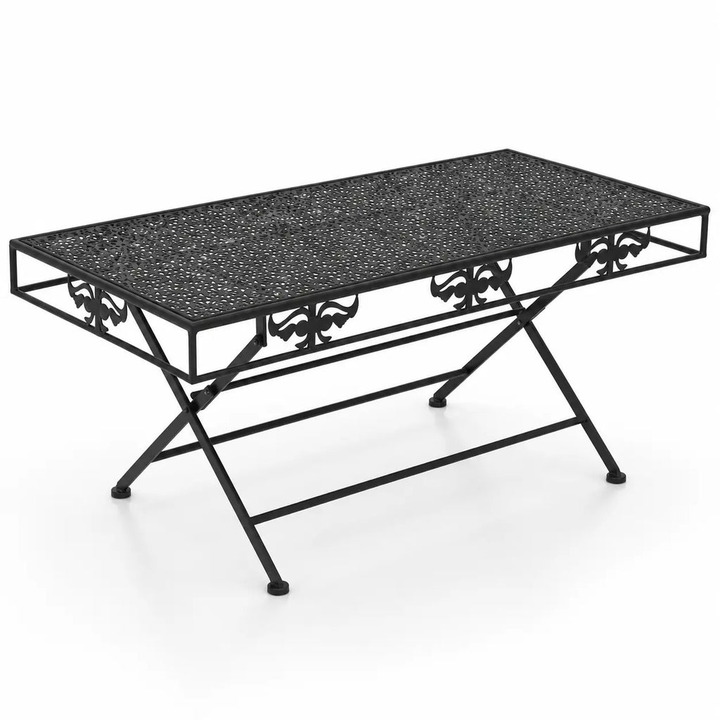 Table basse pliante vintage Rustora en métal noir ajouré avec motifs décoratifs et pieds croisés élégants