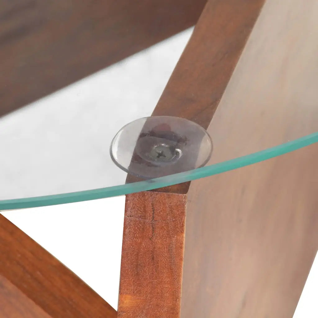 Gros plan sur fixation du plateau en verre et structure en bois massif, détail table basse design moderne