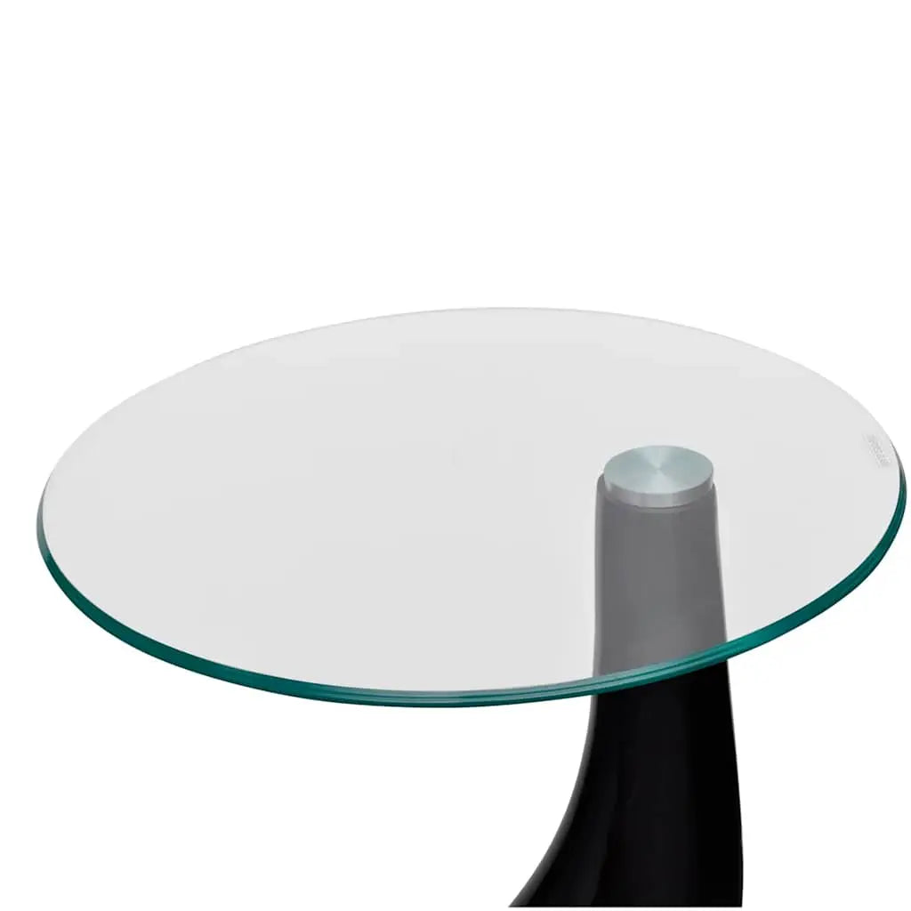 Détail plateau en verre transparent de la table basse Norin avec finition ronde et support noir moderne